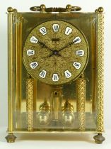 A mid 20th century West German 'Korma' mantel clock, brass case with glass panels, housing an