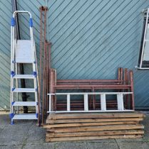 A metal scaffold tower with plank boards, a step ladder and a loft ladder, no brackets