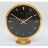 Jaeger LeCoultre, a circular brass desk clock, signed, with batons maker hours with