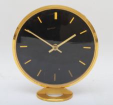 Jaeger LeCoultre, a circular brass desk clock, signed, with batons maker hours with