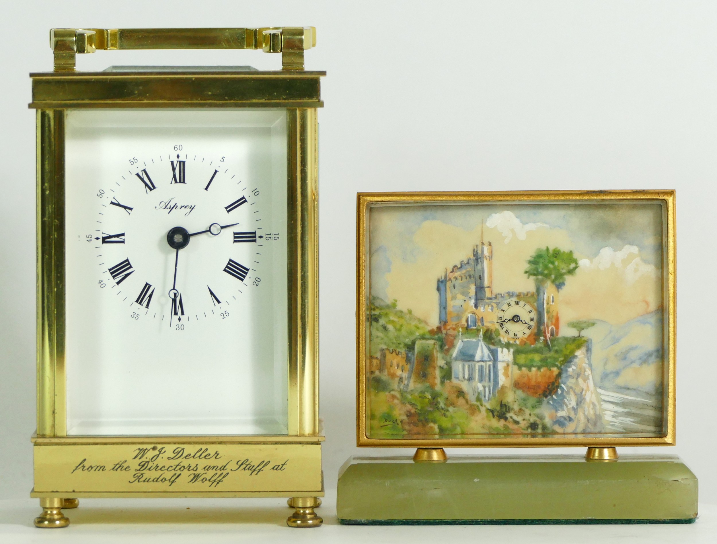 An English 8 day brass carriage clock, retailed by Asprey, together with a Swiss bedside clock on