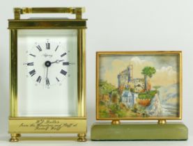 An English 8 day brass carriage clock, retailed by Asprey, together with a Swiss bedside clock on