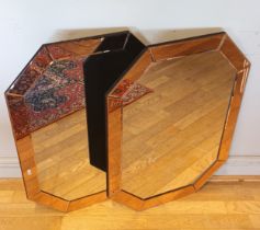 A pair of modern Art Deco style wall mirrors, hexagonal with peach coloured glass borders,