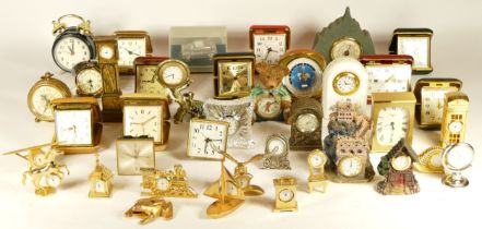A collection of clocks, to include miniature novelty, traveling and bedside alarm clocks, having