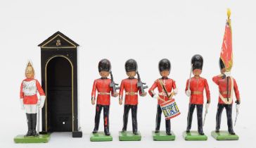 A collection of six Britain's painted lead figures, Queens Guards, 10cm (tallest), together with a