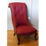 A late 19th century walnut salon chair, having curved scrolling back, upholstered seat, raised on