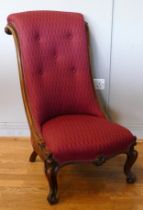 A late 19th century walnut salon chair, having curved scrolling back, upholstered seat, raised on