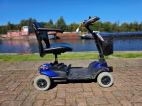 A Strider SD#1 mobility scooter, with instructions and power pack