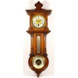 A mahogany cased combination wall clock, thermometer and barometer, circa 1890s. 64cm long.