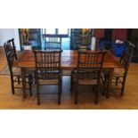 A four planked oak refectory dining table, having tapered legs, together with a set of six high back