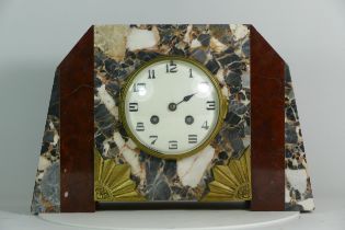 A 1920s Art Deco marble mantel clock, the white enamelled dial with Arabic numerals, housing an 8
