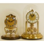 Two mid 20th century German anniversary clocks, having manual wind movements, brass cased with glass