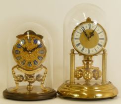 Two mid 20th century German anniversary clocks, having manual wind movements, brass cased with glass