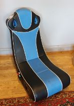 An X-Rocker folding gaming chair.