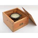 An early 20th century brass marine compass by Iver C. Weilbach & Co, fitted to wooden case.