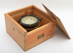 An early 20th century brass marine compass by Iver C. Weilbach & Co, fitted to wooden case.