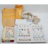 A large collection of loose stamps of the world, primarily mid 20th century and later.