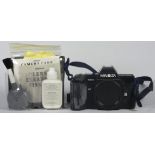 A Minolta 7000 35mm film camera, with a Minolta 35mm-70mm f4 lens and a Minolta 70mm-210mm f 4 lens,