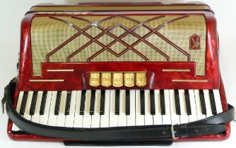 A cased Hohner Virtuola II piano accordion, circa 1960s.