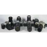 Four 35mm film cameras with lenses, to include a Praktica MTL3 with a Soligor 45mm-150mm f3.5