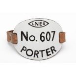 An L.N.E.R porters metal numbered armband, 'L.N.E.R No 607 porter'.