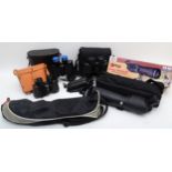 Four pairs of cased binoculars, together with a Optus spotting scope (boxed) and a tripod.