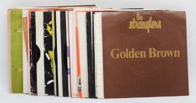 A collection of thirty five vinyl 45rpm single records, rock and pop, circa 1970s/80s.