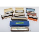 A collection of eight pocket Hamonica's, including Vermona bandmaster, Hohner band and Pocket Pal
