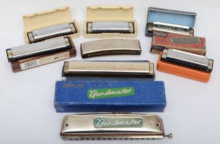 A collection of eight pocket Hamonica's, including Vermona bandmaster, Hohner band and Pocket Pal