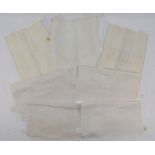 A collection of seven embroidered first class seat head rest covers, (Anitimacassars) to include