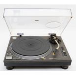 A Technics SE-1210 turntable, direct drive, with power and audio cables.