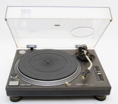 A Technics SE-1210 turntable, direct drive, with power and audio cables.