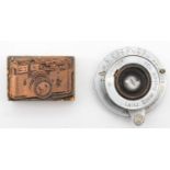 A Leica Leitz Elmar 3.5cm f3.5 lens, made in Germany, together with a printing plate / stamp, cooper