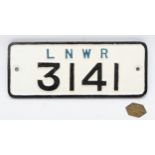 'L.N.W.R 3141' cast-iron wagon plate together with an L.M.S.R Bradford pay-check. (2)