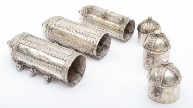 Three white metal scroll holders/mezuzah, with filigree decoration, two with scrip tabs, 12, 14, and