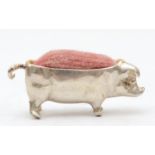 An Elizabeth II silver pig pin cushion, London 1997, 4.5cm, 21gm.