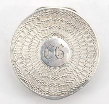 A George V silver compact and mirror with chased decoration, Birmingham 1925, 4.5cm.