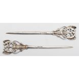 A Victorian silver skewer, London 1865, with cast squirrel terminal, 12.5cm and another London 1897,