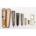 Three silver cheroot cases, a silver cased cigar cutter, London 1976, and a cased sprung cheroot