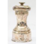 A silver plated mechanical pepper pot,9 x 4.5cm.