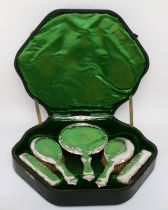 An Edwardian silver mounted dressing table set, Birmingham and Chester 1908, with monogrammed