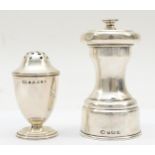A George V silver mechanical pepper pot, Birmingham 1920, together with another pepper pot,