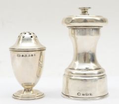 A George V silver mechanical pepper pot, Birmingham 1920, together with another pepper pot,