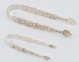 A Victorian silver pair of cast sugar tongs, Chester 1896, 9.5cm together with George III silver