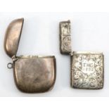 A Victorian silver vesta case, Birmingham 1889, with chased scroll decoration, together with