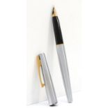 Sheaffer, a steel bodied fountin pen with 14k gold nib, 14cm.