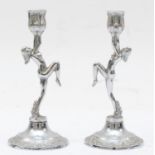 A pair of silver plated candle sticks in the Art Deco style, 11.5 x 5cm.