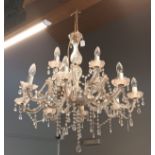 A glass and perspex lustre drop eight branch two tier chandelier, 80cm drop.
