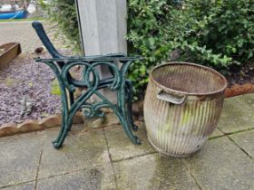 A pair of cast metal bench ends, a pair of table ends and a galvanised washing tub with soap holder