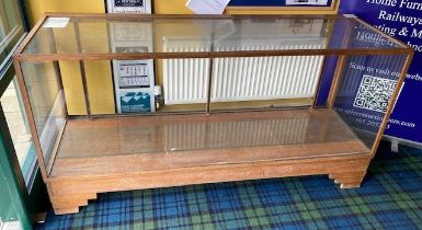 An early 20th century oak Dudley & Co. haberdashery shop display cabinet